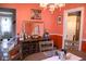 Coastal dining room with colorful walls, a chandelier and a decorative display cabinet with wine storage at 643 Harlan St, Plainfield, IN 46168