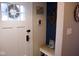 Cozy entryway featuring a white front door, built-in bench, and nautical decorations giving a warm welcome at 643 Harlan St, Plainfield, IN 46168