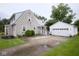Charming home with a detached two-car garage and concrete driveway at 643 Harlan St, Plainfield, IN 46168