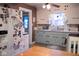 Bright kitchen with white cabinets and updated appliances, plus an adjacent breakfast area at 643 Harlan St, Plainfield, IN 46168