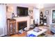 Charming living room with a fireplace, hardwood floors, and a cozy atmosphere for relaxation and entertainment at 643 Harlan St, Plainfield, IN 46168