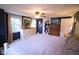 Comfortable bedroom with neutral colors, hardwood floors, and large windows at 643 Harlan St, Plainfield, IN 46168