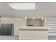 Basement bar with pendant lighting, a counter area, and adjacent shelving, ideal for hosting and entertaining guests at 649 Lawndale Dr, Plainfield, IN 46168