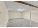 Finished basement with carpet flooring, a support beam, and natural light offering a versatile space for various uses at 649 Lawndale Dr, Plainfield, IN 46168