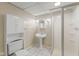 Basement bathroom featuring a pedestal sink, walk-in shower, and built-in cabinet, providing functionality and classic design at 649 Lawndale Dr, Plainfield, IN 46168
