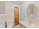 Clean bathroom with vanity sink, classic fixtures, and tiled walls at 649 Lawndale Dr, Plainfield, IN 46168