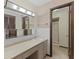 This primary bathroom features a large vanity with cabinets, sink, mirror, and stand up shower at 649 Lawndale Dr, Plainfield, IN 46168