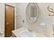 Bright bathroom featuring a vanity with a sink, an oval mirror, and tile walls at 649 Lawndale Dr, Plainfield, IN 46168