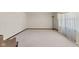 Spacious bedroom featuring neutral carpeting and a large window allowing natural light at 649 Lawndale Dr, Plainfield, IN 46168