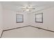 Light-filled bedroom with carpet, a ceiling fan and two bright windows at 649 Lawndale Dr, Plainfield, IN 46168