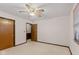 This bedroom features neutral carpet, a ceiling fan with overhead lighting and natural light from a window at 649 Lawndale Dr, Plainfield, IN 46168