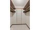 This walk-in closet features shelving and shoe racks at 649 Lawndale Dr, Plainfield, IN 46168