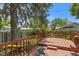 Backyard deck with views of trees and the yard beyond at 649 Lawndale Dr, Plainfield, IN 46168