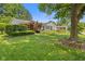 Beautiful brick ranch home with mature trees and neatly trimmed bushes at 649 Lawndale Dr, Plainfield, IN 46168