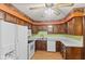 Cozy kitchen features wooden cabinets, a white countertop, and essential appliances at 649 Lawndale Dr, Plainfield, IN 46168