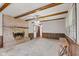 Comfortable living room showcasing a brick fireplace and natural wood accents at 649 Lawndale Dr, Plainfield, IN 46168