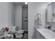 Bright bathroom featuring a white vanity, updated lighting, and a clean toilet at 725 2Nd St, Shelbyville, IN 46176