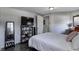 Bedroom with warm lighting and stylish decor. Features a TV, a bed, and a closet at 725 2Nd St, Shelbyville, IN 46176