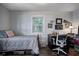 Charming bedroom features a comfortable bed, desk area, and natural light from the window at 725 2Nd St, Shelbyville, IN 46176