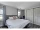 Bright bedroom with a large bed, soft gray linens, and a view from the windows at 725 2Nd St, Shelbyville, IN 46176