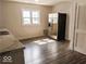 Kitchen with wood floors, a stainless steel fridge, natural lighting, and plenty of cabinet space at 725 2Nd St, Shelbyville, IN 46176