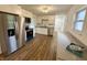 Bright kitchen featuring new appliances, white cabinetry, and updated flooring, perfect for cooking and entertaining at 7301 E Wiser Ave, Camby, IN 46113