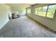 Inviting living room featuring neutral walls and carpet, creating a cozy atmosphere with bright, natural lighting at 7301 E Wiser Ave, Camby, IN 46113