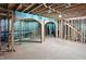 Unfinished basement showing exposed wooden beams, lighting fixtures and unfinished staircase at 7843 E Triple Crown Ln, Camby, IN 46113
