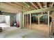 Open basement area with wood framing, an unfinished ceiling, and a red portable generator at 7843 E Triple Crown Ln, Camby, IN 46113