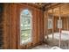 Unfinished bedroom featuring rough framing with large windows allowing lots of natural light at 7843 E Triple Crown Ln, Camby, IN 46113