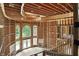 Sweeping entryway displaying unfinished wood framework, arched windows, and staircase for a personalized touch at 7843 E Triple Crown Ln, Camby, IN 46113