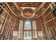 Grand entryway with unfinished wood frame construction, large windows, and an impressive ceiling design at 7843 E Triple Crown Ln, Camby, IN 46113