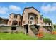 Exterior view of a large pink brick home, with a backyard at 7843 E Triple Crown Ln, Camby, IN 46113