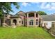 Beautiful brick house with a well-manicured lawn, stone features, and large windows at 7843 E Triple Crown Ln, Camby, IN 46113