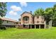 Distinctive home boasting brick facade, grand arched entryway, and well-maintained lawn at 7843 E Triple Crown Ln, Camby, IN 46113
