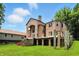 Beautiful brick home featuring unique architectural design, large windows, and a well manicured lawn at 7843 E Triple Crown Ln, Camby, IN 46113