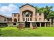 Unique home featuring brick exterior, large windows, and outdoor staircases at 7843 E Triple Crown Ln, Camby, IN 46113