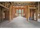 Unfinished grand foyer showcasing a dramatic staircase and large windows for natural light at 7843 E Triple Crown Ln, Camby, IN 46113