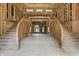 Unfinished grand foyer featuring a dual staircase and framed doorway at 7843 E Triple Crown Ln, Camby, IN 46113