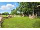 Expansive front lawn with brick fence detail around the property's perimeter at 7843 E Triple Crown Ln, Camby, IN 46113