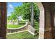 Brick archway and landscaped front yard, showcasing architectural detail at 7843 E Triple Crown Ln, Camby, IN 46113