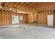 Garage under construction showing wood framing, concrete floor, and window placement at 7843 E Triple Crown Ln, Camby, IN 46113