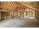 Spacious framed interior showcasing the beam structure, archways, and window placement at 7843 E Triple Crown Ln, Camby, IN 46113