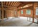Spacious unfinished interior showcasing the wood framing, arched entryway, and natural light at 7843 E Triple Crown Ln, Camby, IN 46113