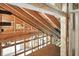 Home under construction, showcasing framing and beam structure of a home at 7843 E Triple Crown Ln, Camby, IN 46113