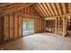 Spacious framed interior showcasing the beam structure, window placement, and open layout at 7843 E Triple Crown Ln, Camby, IN 46113