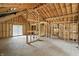 Framed interior showcasing the beam structure, window placement, and open layout at 7843 E Triple Crown Ln, Camby, IN 46113