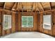 A room with natural light through the three large windows with a view of nature, construction not completed yet at 7843 E Triple Crown Ln, Camby, IN 46113