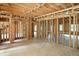 Interior framing showcasing the layout of a new construction home with abundant natural light through ample windows at 7843 E Triple Crown Ln, Camby, IN 46113