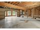 Interior view showcasing the unfinished space with exposed wood beams, brick arches, and ample room layout at 7843 E Triple Crown Ln, Camby, IN 46113